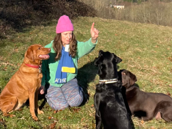 dog-walker Lucy Melzer and three dogs